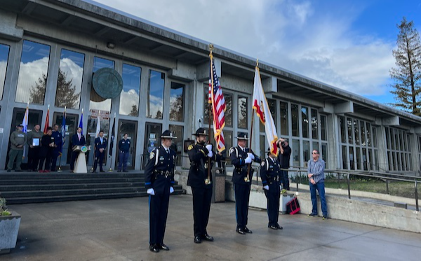 photo of a ceremony in front of the courthouse to honor veterans